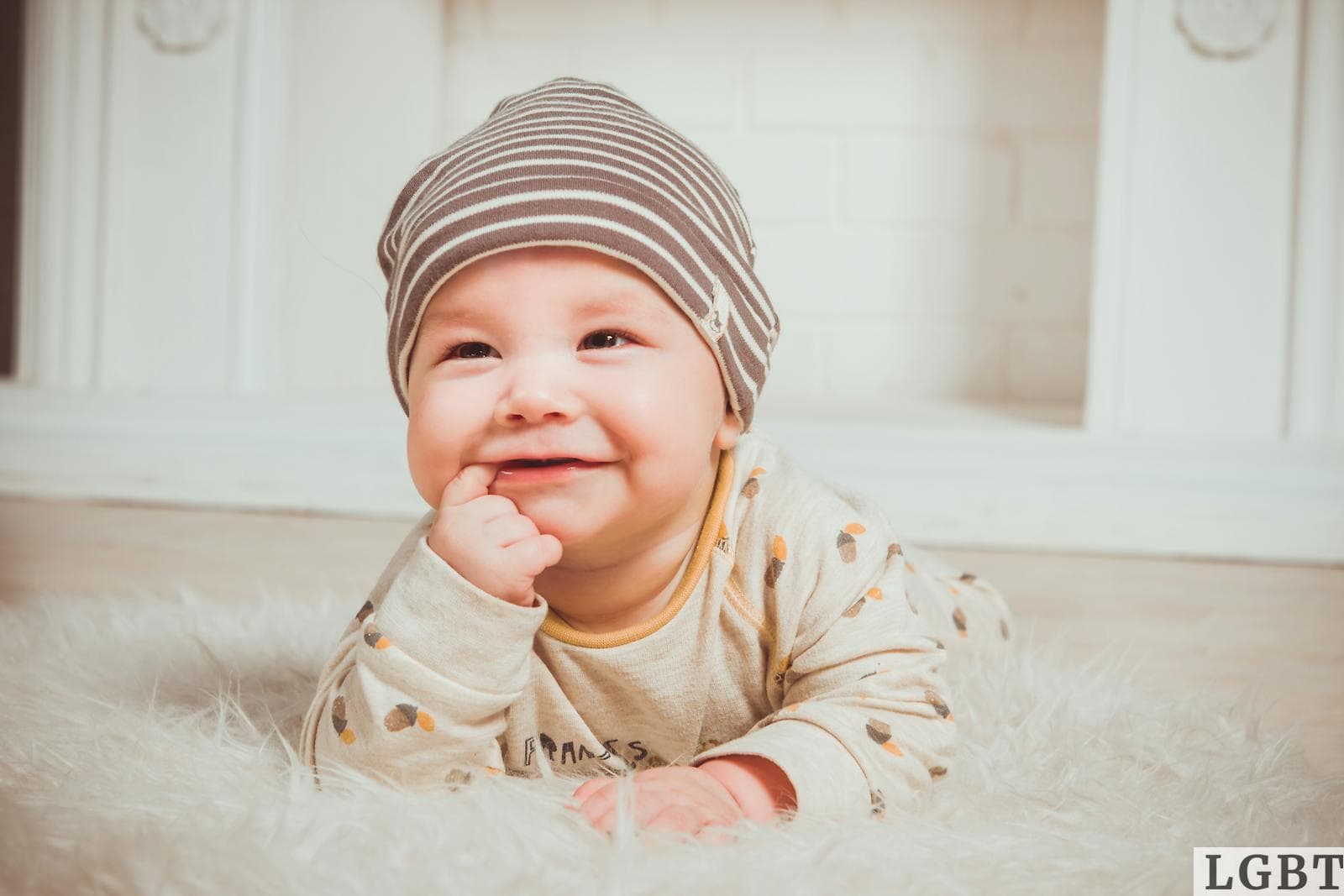 Smiling Baby Biting Right Index Finger